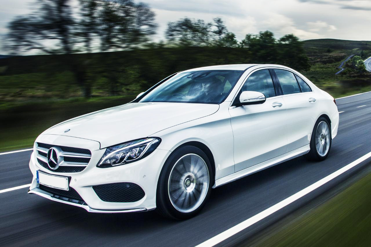 White Mercedes-Benz C-Class on the open road